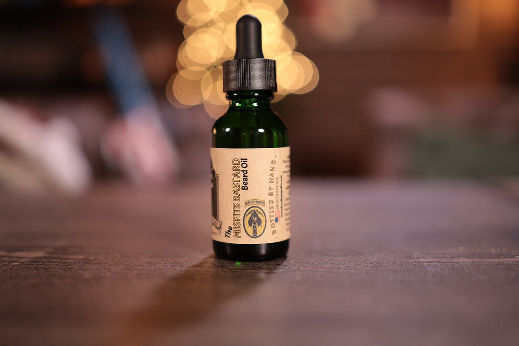 1oz green bottle Misfits beard oil with dropper top