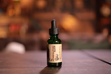 1oz green bottle Vetiver beard oil with dropper top